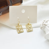 Golden Portrait Embossed Earrings