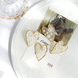 Transparent Heart-Shaped Earrings with Golden Edging