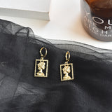 Golden Portrait Embossed Earrings